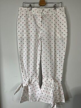 White Cropped Pants with Red & Navy Palm Print w/Ruffled Ties on each leg. 
Sz L